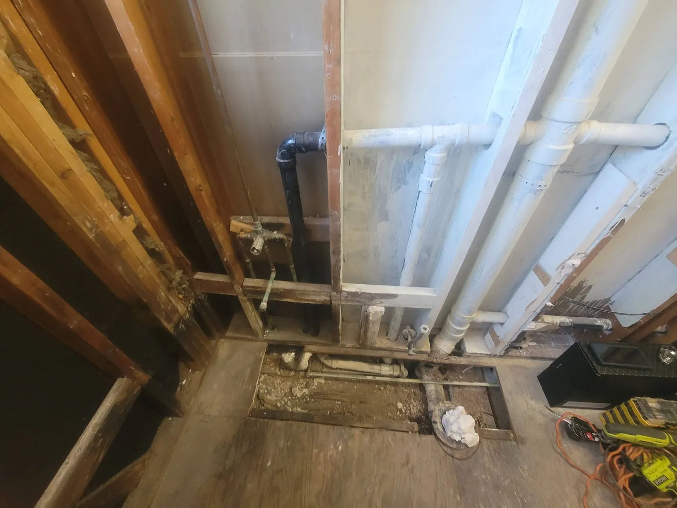Precision bathroom wall tile installation in progress