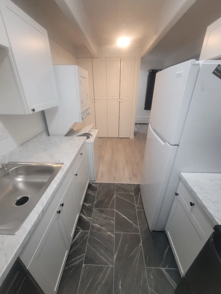 Modern kitchen remodel with bright cabinets and stone countertops